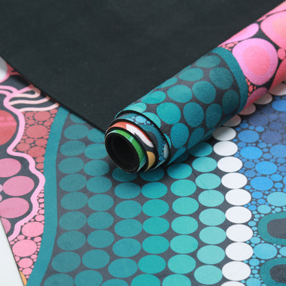 A Breath of Fresh Air Indigenous Yoga Mat in use, displaying the sacred Aboriginal design with traditional symbols of wind, breath, and life force that create a spiritual foundation for yoga practice and connection to country
