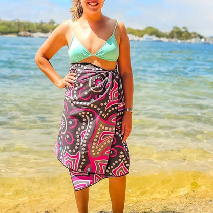 Detailed view of Frangipani Indigenous Travel Towel featuring traditional Aboriginal frangipani symbols, flowering patterns, and cultural designs that represent the sacred relationship between community and the natural beauty of tropical country

