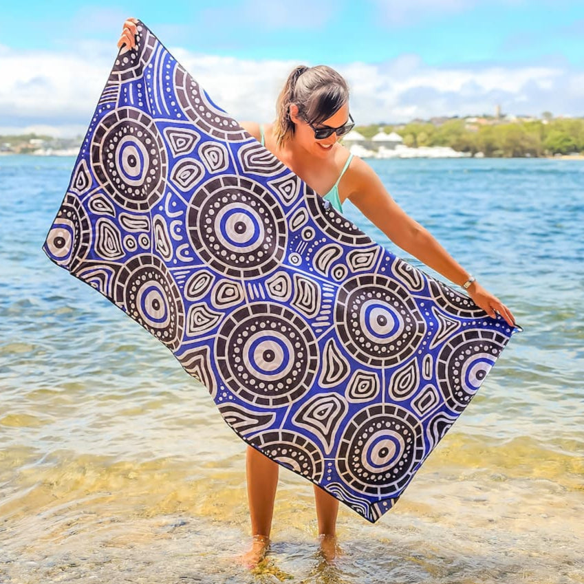 Full view of Seascape Indigenous Travel Towel displaying authentic Aboriginal ocean dreamtime design with traditional symbols representing water spirits, marine life, and the sacred connection between land and sea
