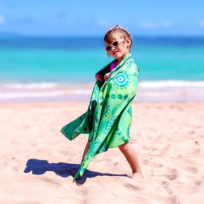 Full view of Starfish Kids Indigenous Travel Towel displaying authentic Aboriginal starfish artwork with traditional symbols representing sea creatures, ocean wisdom, and the sacred relationship between children and marine environments in vibrant green