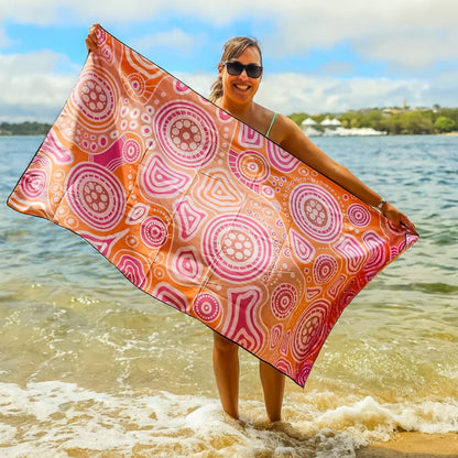 Full view of Walkabout Indigenous Travel Towel displaying authentic Aboriginal walkabout design with traditional symbols representing spiritual journey, cultural pathways, and the sacred connection between traveler and country in vibrant orange tones